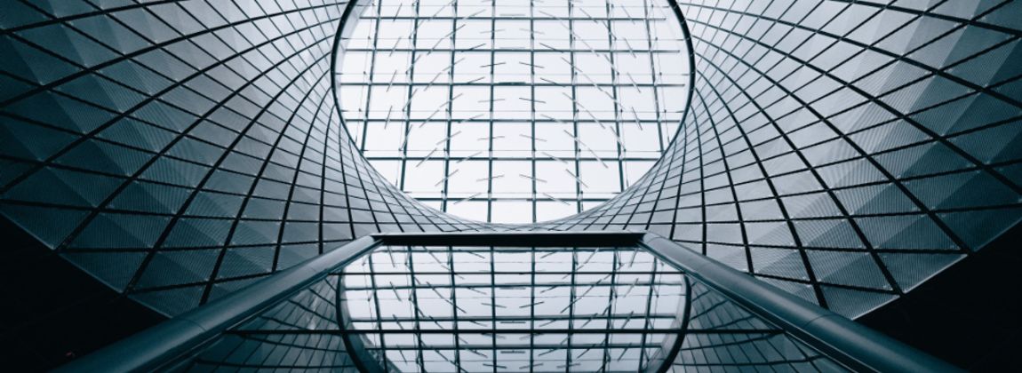 A geometric glass roof seen from below