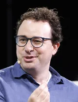 Dario Amodei speaking at TechCrunch Disrupt in San Francisco in September 2023