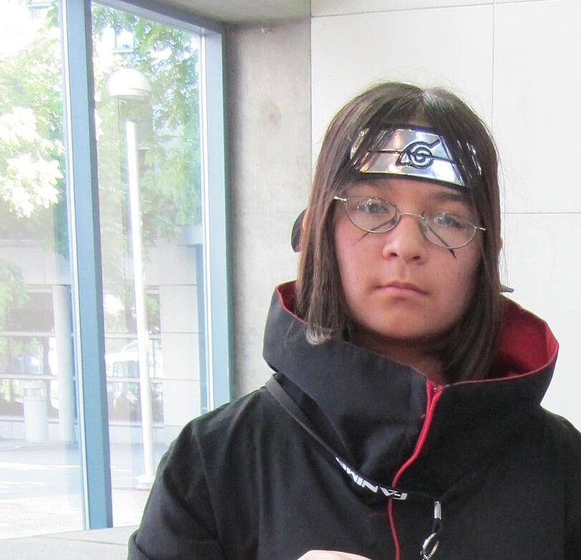 A cosplayer in costume as Itachi Uchiha, photographed at FanimeCon in 2010