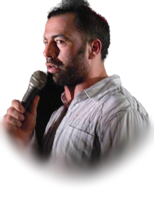 Joe Rogan performing stand-up comedy with a microphone