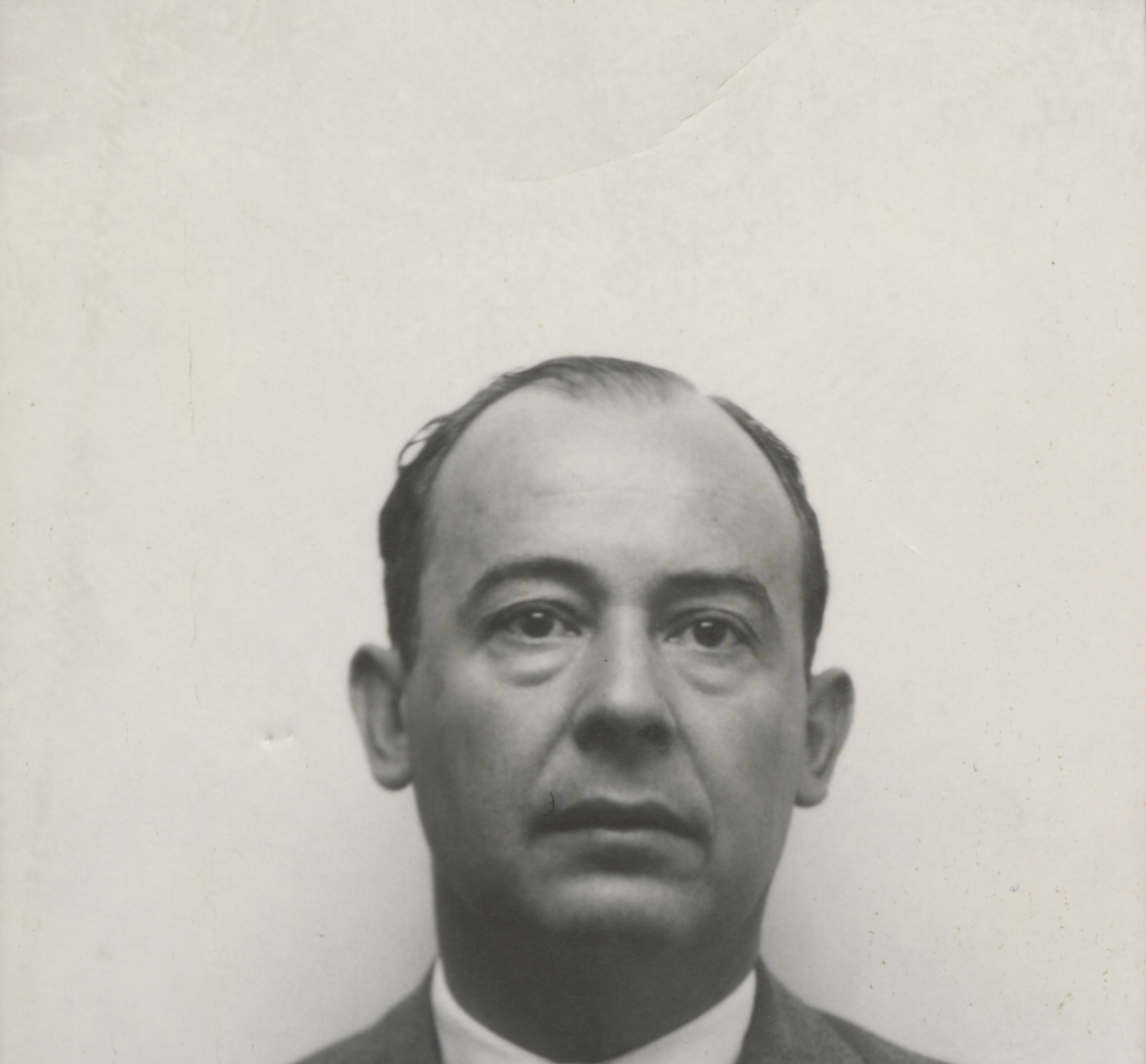 John von Neumann in a Los Alamos identity badge photograph, c. 1940s