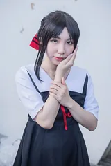 A cosplayer as Kaguya Shinomiya, photographed at an anime convention in 2020