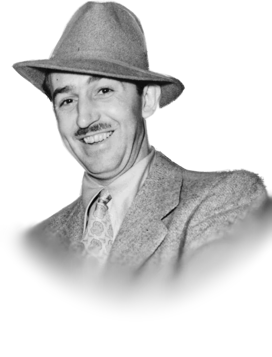 Walt Disney smiling in a fedora and tweed jacket, photographed in 1938