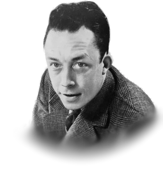 Albert Camus with dark swept-back hair in a checked tweed jacket and tie, leaning forward on a desk and looking at the camera in a 1957 black-and-white press photograph