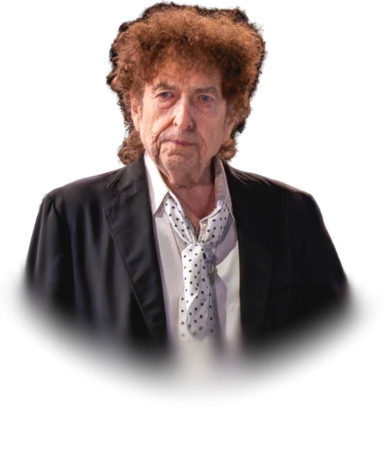 Bob Dylan with curly auburn hair, in a dark jacket over a white shirt and a polka-dot neckerchief, standing on stage during a concert in Kilkenny, Ireland, in July 2019