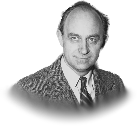 Enrico Fermi standing in front of laboratory control equipment in a photograph from the 1940s
