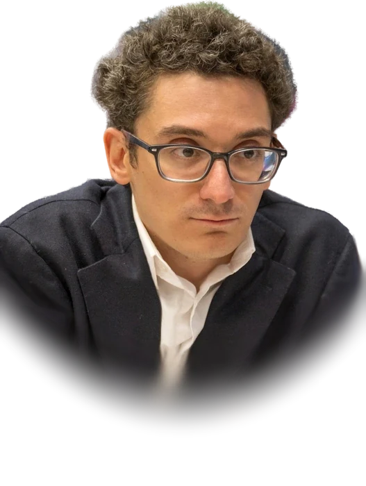 Fabiano Caruana, a chess grandmaster with curly brown hair and dark-framed glasses, in a dark blazer over a white shirt, leaning over the board with chess pieces in the foreground, in January 2025