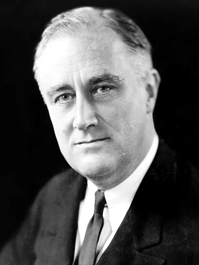 Franklin D. Roosevelt in a dark suit, white shirt and tie, looking toward the camera in a black-and-white studio portrait made in December 1933
