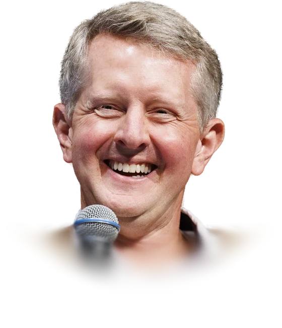 Ken Jennings laughing and holding a microphone, in a tan cardigan over a white open-collar shirt, recording an episode of the Omnibus podcast at the Library of Congress in September 2026
