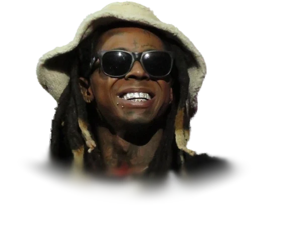 Lil Wayne smiling in sunglasses and a cream bucket hat on stage in December 2015