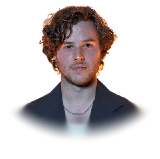 Nolan Gould, the actor who played Luke Dunphy on Modern Family, with curly hair and a dark open coat over a light blue top, at the Cinequest Film Festival in March 2026