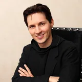 Pavel Durov seated with his arms crossed in a photograph from 2012