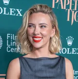 Scarlett Johansson smiling in a gray sleeveless top at the New York Film Festival in September 2026