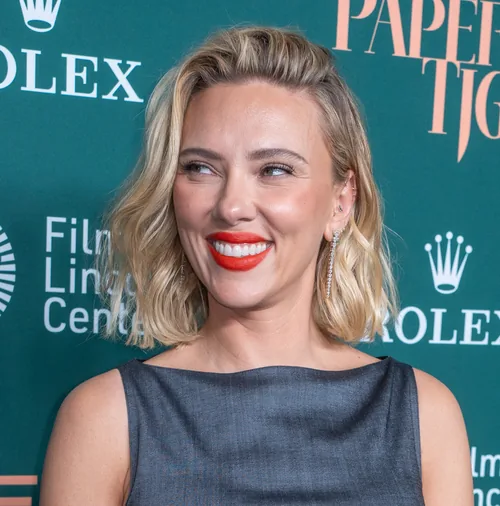 Scarlett Johansson smiling in a gray sleeveless top at the New York Film Festival in September 2026