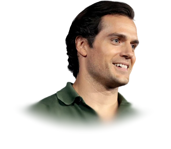 Henry Cavill, the actor who played Superman in the 2013 film Man of Steel, smiling in a green polo shirt at San Diego Comic-Con in July 2019