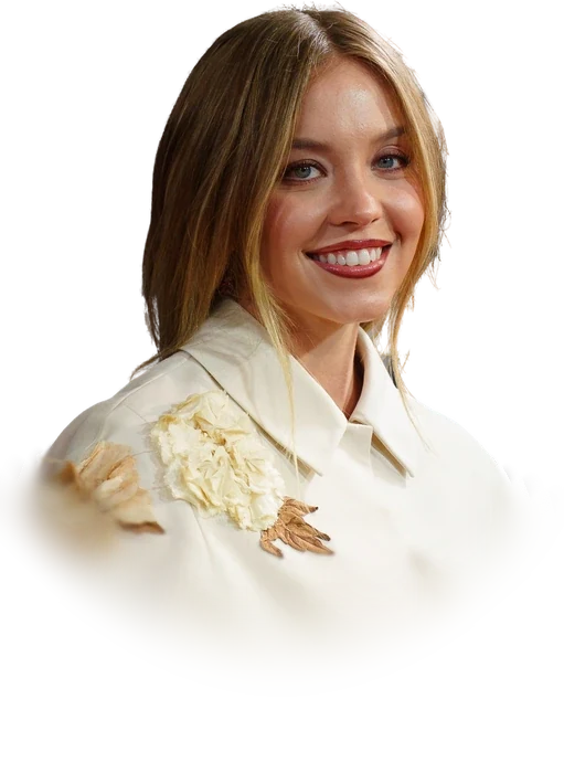Sydney Sweeney smiling in a cream cape-sleeved jacket at the Toronto International Film Festival in September 2024