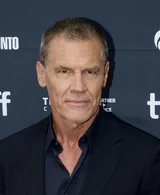 Josh Brolin, the actor who plays Thanos in the Marvel Cinematic Universe films, in a dark navy jacket and shirt at the Toronto International Film Festival in 2025