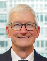 Tim Cook smiling in glasses and a dark suit in New York City in September 2026