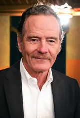 Bryan Cranston, the actor who played Walter White in Breaking Bad, in a dark blazer and an open-collar white shirt in May 2026